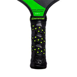 Close-up of a black pickleball paddle grip with green honeycomb pattern and GAMMA branding.
