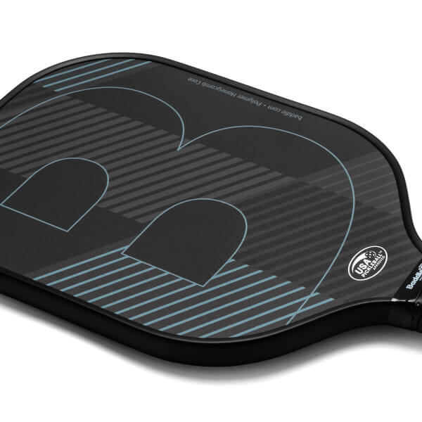 Top-down view of a black pickleball paddle with a large blue B logo and USA Pickleball seal.