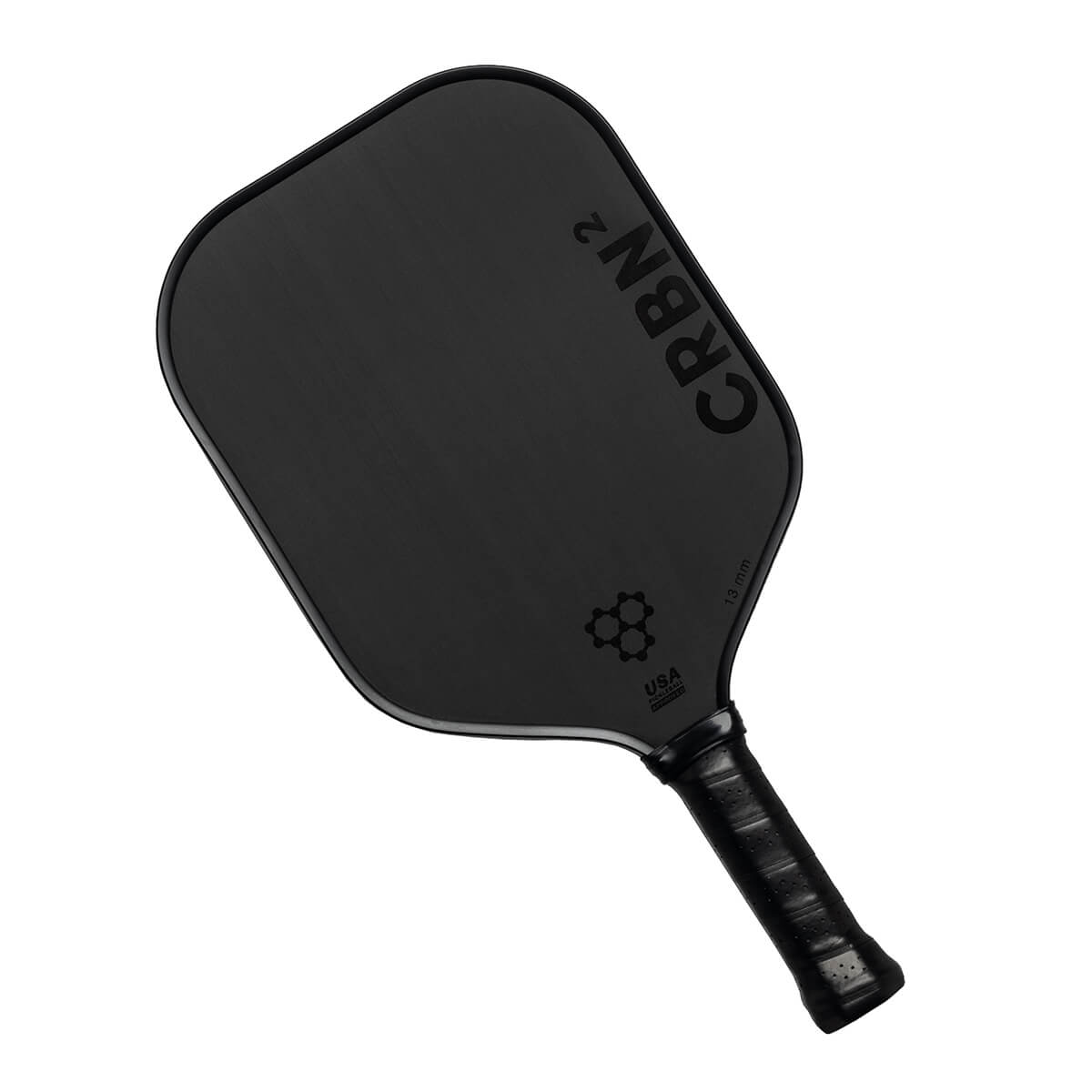 Top-down view of a black pickleball paddle with CRBN² branding and a honeycomb logo.