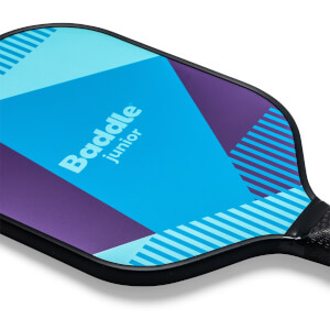 Corner view of a blue and purple Baddle Junior pickleball paddle with geometric patterns and a black grip.