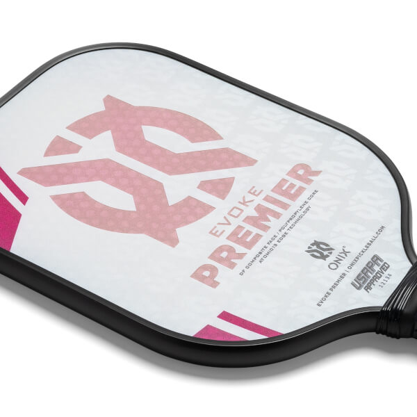 Corner view of a white pickleball paddle with pink graphics, EVOKE PREMIER text, and USAPA approved logo.