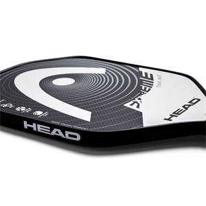 Corner view of a black pickleball paddle with a large white HEAD logo, EXTREME TOUR MAX text, and carbon fiber texture.