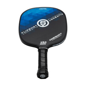 Top-down view of a black pickleball paddle with blue geometric design, FLIPSHOT text, and USA PICKLEBALL APPROVED label.