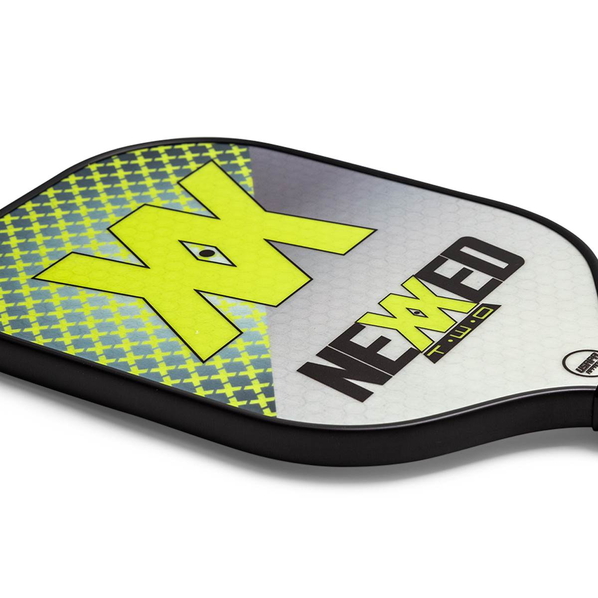 Corner view of a gray and yellow pickleball paddle with a large XX graphic and NEXXED T-WO text.