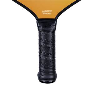 Close-up of a black pickleball paddle grip with perforated texture and USAPA APPROVED text.