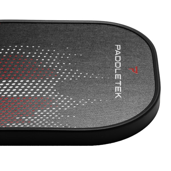 Corner view of a black pickleball paddle with a red and white dot pattern and PADDLETEK text.