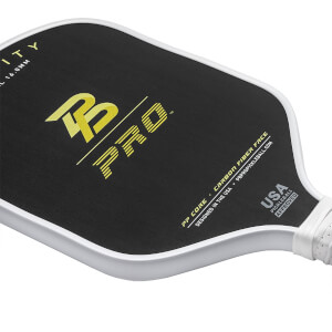 Corner view of a black pickleball paddle with yellow B PRO logo and USA PICKLEBALL APPROVED text.