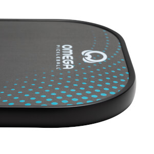 Corner view of a black pickleball paddle with white OMEGA logo and blue dot pattern.