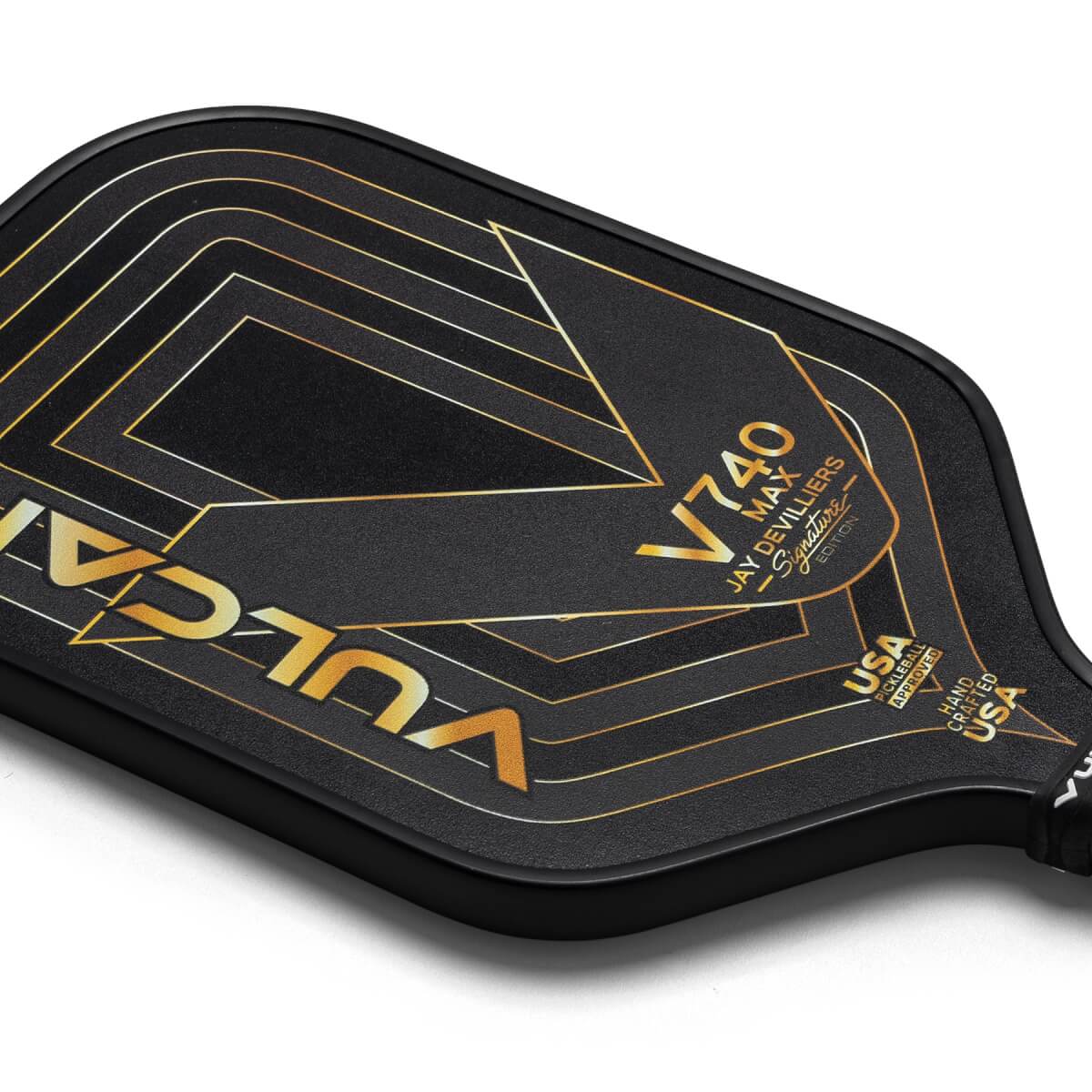 Corner view of a black Vulcan V740 Max pickleball paddle with gold geometric lines, VULCAN text, and USA PICKLEBALL APPROVED text.