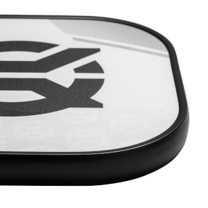Corner view of a white pickleball paddle with a black border and a large black graphic.