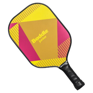 Top-down view of a yellow and pink Baddle Junior pickleball paddle with geometric patterns and a black grip.