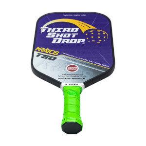 Front view of a purple pickleball paddle with Third Shot Drop logo, Kratos TSD text, and a green grip.