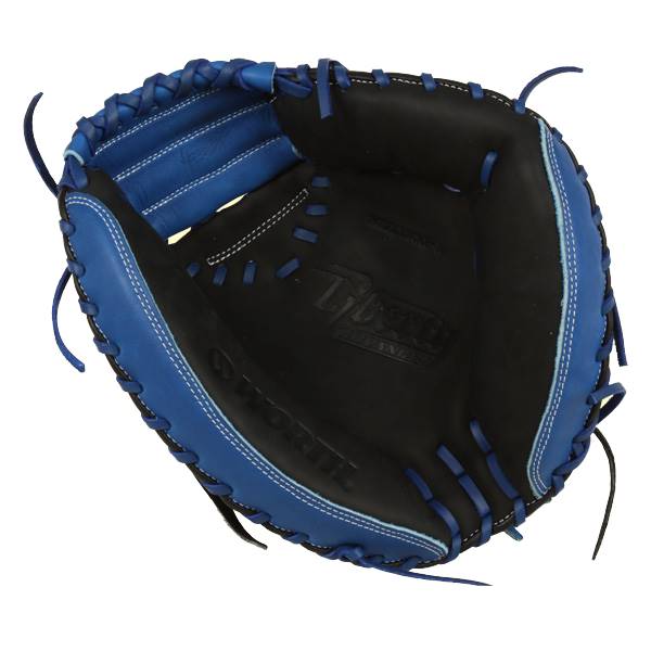 Top-down view of a blue and black catchers mitt with white stitching and WORTH embossed on the palm.