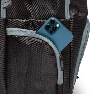 Close-up of a black backpack with a blue phone in a zippered pocket and grey trim.