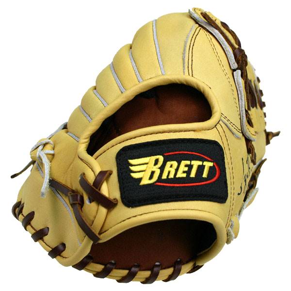Side view of a tan baseball glove with a black and yellow Brett logo and brown lacing.
