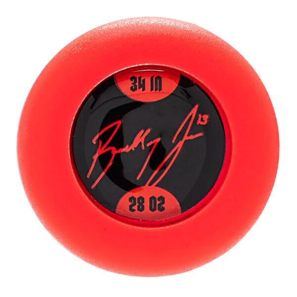 Top-down view of a red softball bat end cap with a black insert displaying 34 IN, 28 OZ, and a red signature.