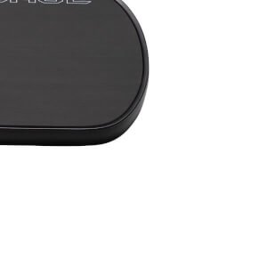 Close-up of top-left corner of a black pickleball paddle with a textured surface and rounded black edge bumper.