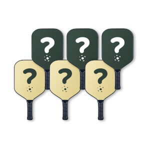 Front view of six dark green and tan pickleball paddles, each featuring a large question mark with a pickleball icon at its base.