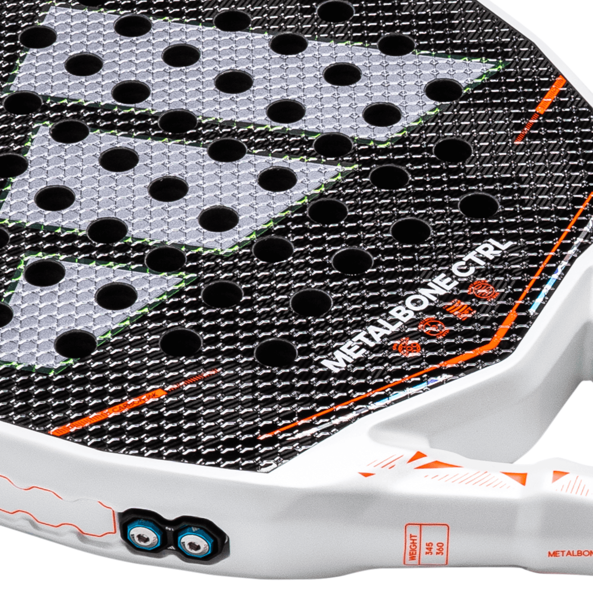 Close-up of the racket face showing circular holes, "METALBONE CTRL" text, and orange accents.