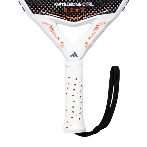 Close-up of a white and black Metalbone Ctrl racket handle with an Adidas logo, orange accents, and a black wrist strap.