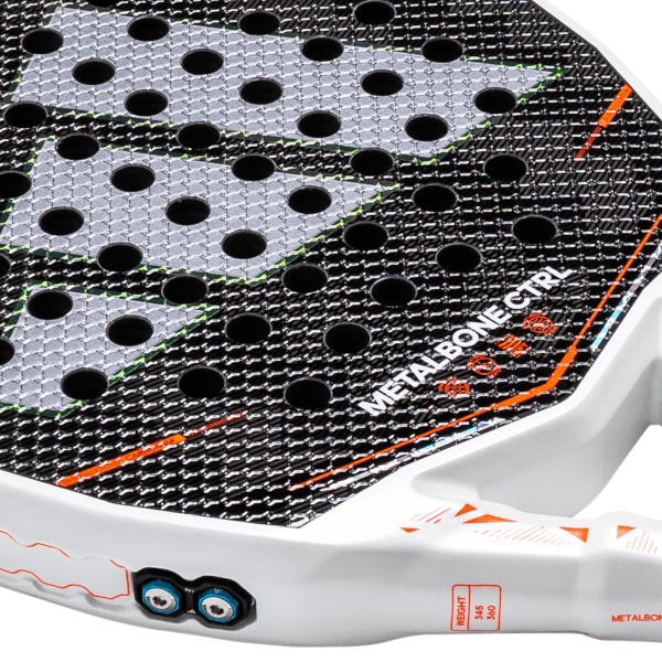 Close-up of the racket face showing circular holes, "METALBONE CTRL" text, and orange accents.