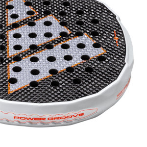 Corner view of a racket showing the "POWER GROOVE" text, circular holes, and orange accents.
