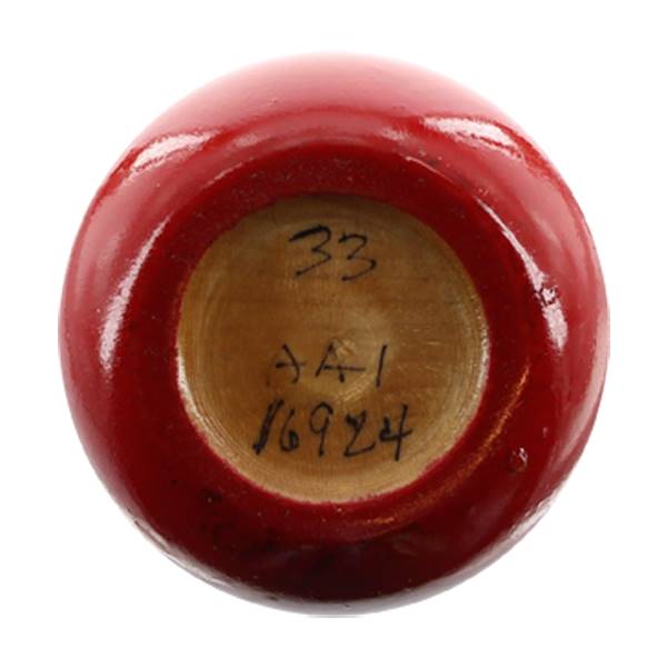Bottom view of a red baseball bat with 33, AA1, and 16924 written on the end.