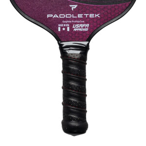Top-down view of a purple pickleball paddle with Paddletek branding and a black grip.