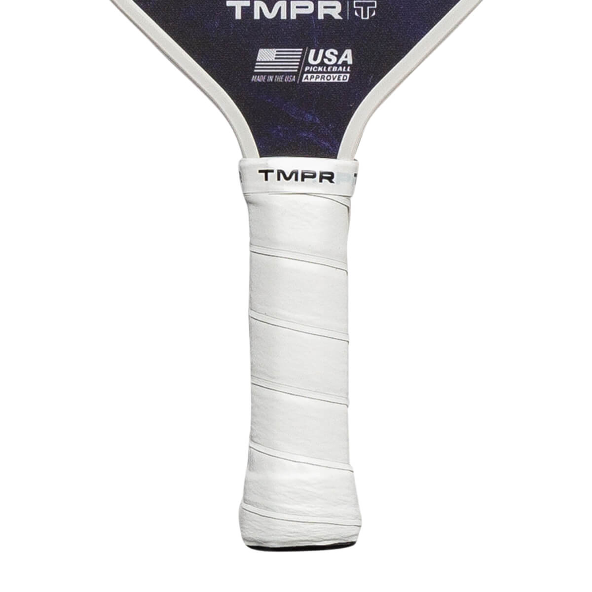 Close-up of a white pickleball paddle grip with TMPR branding and a USA Pickleball Approved logo.