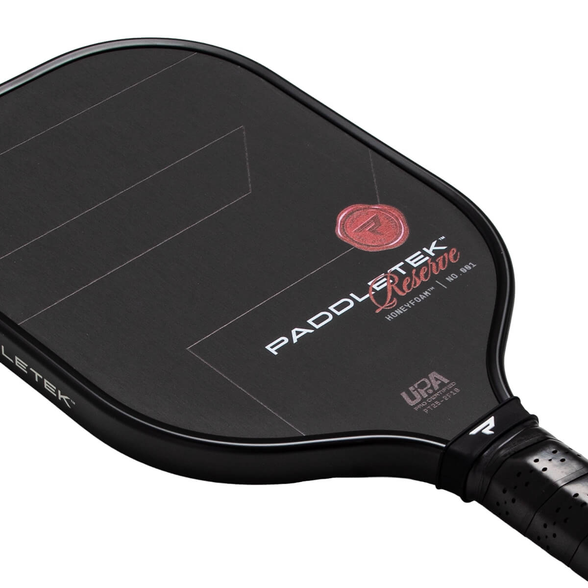 Angled view of a black pickleball paddle with PADDLETEK Reserve Honeyfoam™ text, a red seal logo, and subtle gray lines.