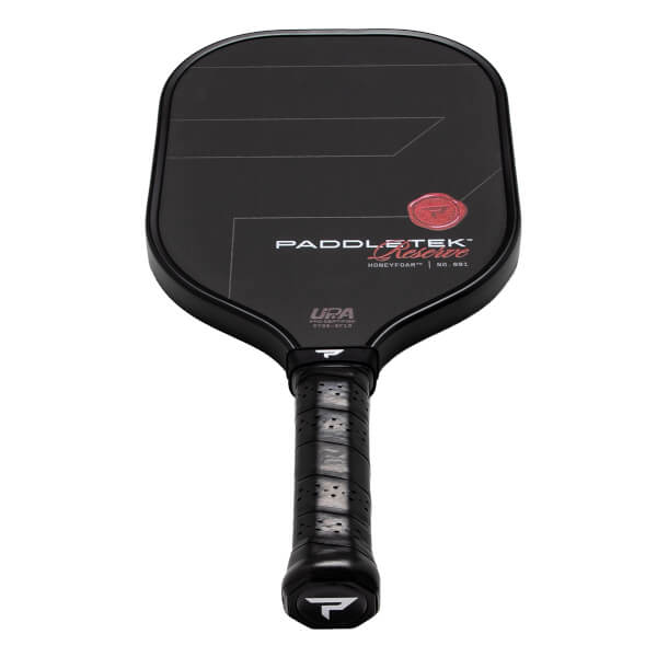 Front view of a black pickleball paddle with PADDLETEK Reserve branding, a red circular logo, and a textured black grip.