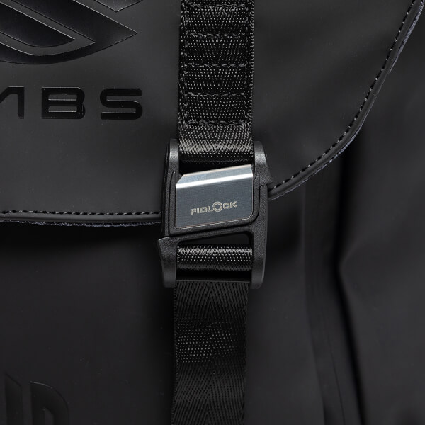 Close-up of the black Fidlock buckle and textured strap, featuring the FIDLOCK logo and partial LABS branding embossed on the matte black material.