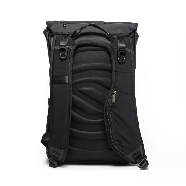 Back view of the black backpack featuring a contoured, padded back panel, adjustable shoulder straps with gear hooks, and a small zippered pocket on the right strap.