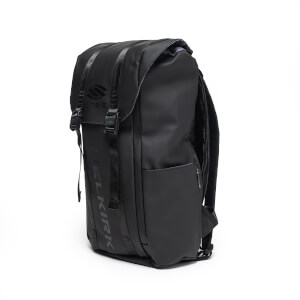Corner view of a black backpack with two buckled straps over a top flap featuring the "S LABS" logo, with "SELKIRK" embossed vertically down the front.