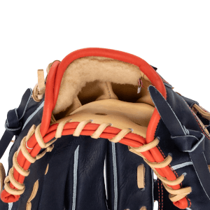 Close-up of the Mack Provisions Freedom Exclusive baseball glove showing the tan interior, red lacing, and navy exterior.