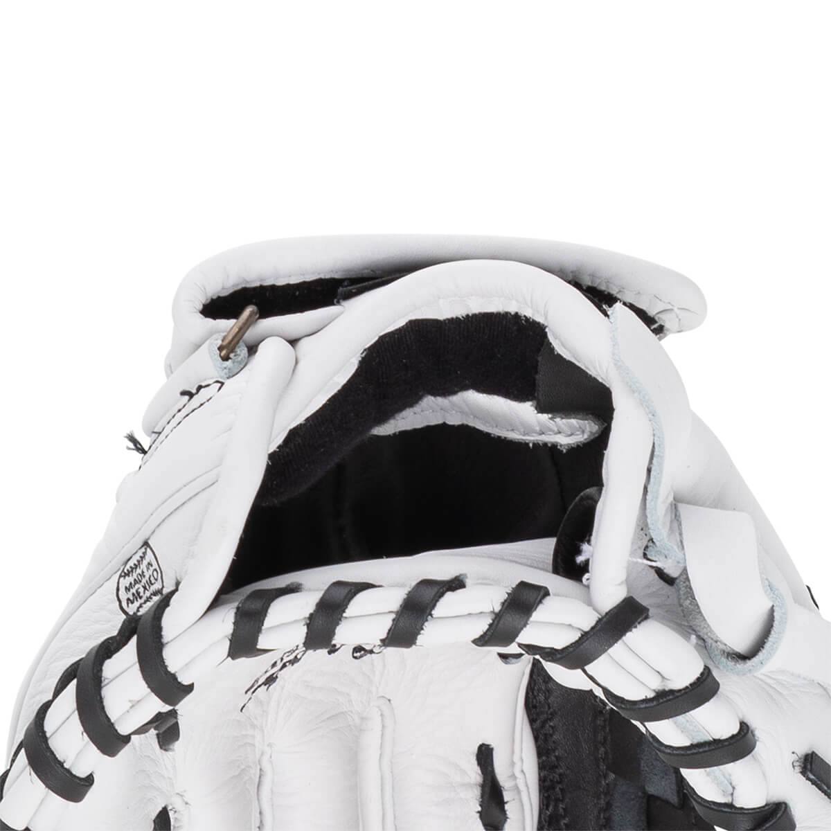 Close-up view of a white baseball glove's wrist opening featuring black laces and a stamp that reads MADE IN MEXICO.