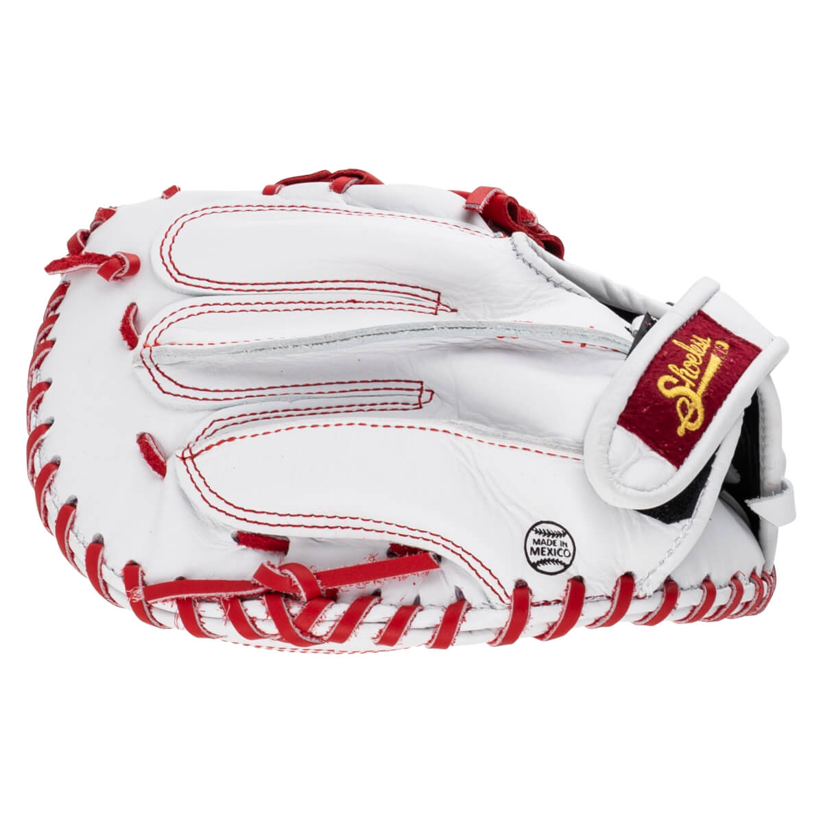 Back view of the white catcher's mitt with red laces, featuring a red wrist strap with a gold Shoeless Joe logo and a circular MADE IN MEXICO stamp.