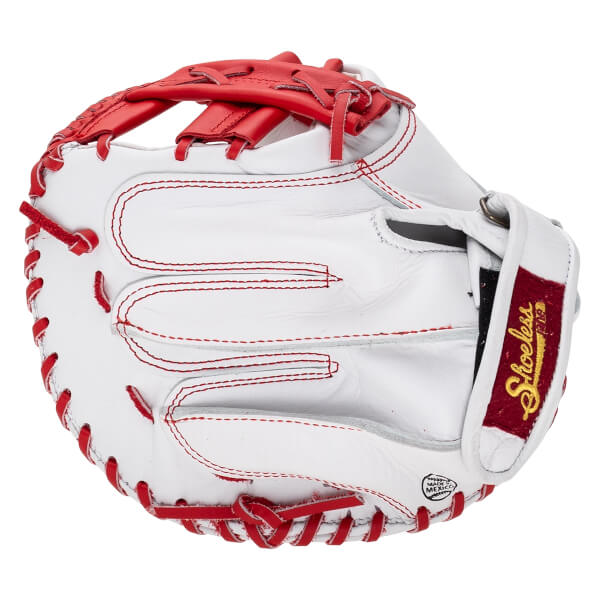 Back view of the white leather mitt with red laces and stitching, featuring a red wrist strap with gold "Shoeless Jane" text and a "MADE IN MEXICO" stamp.