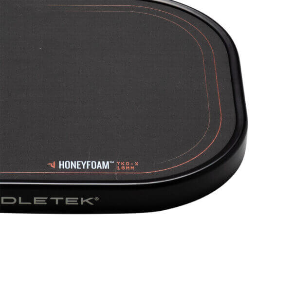 Corner view of the Paddletek TKO-X paddle showing "HONEYFOAM™ TKO-X 16MM" and "PADDLETEK®" text.
