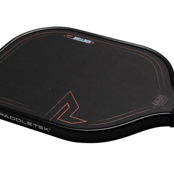 Corner view of the black Paddletek TKO-X paddle showing the "PADDLETEK" logo and a red geometric design.