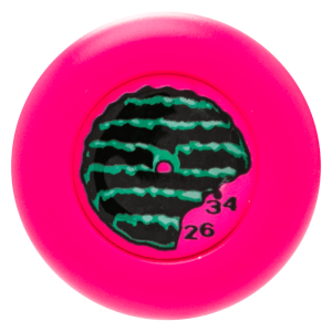 Top-down view of a bright pink round object with a black and green watermelon design and the numbers "26" and "34" visible.