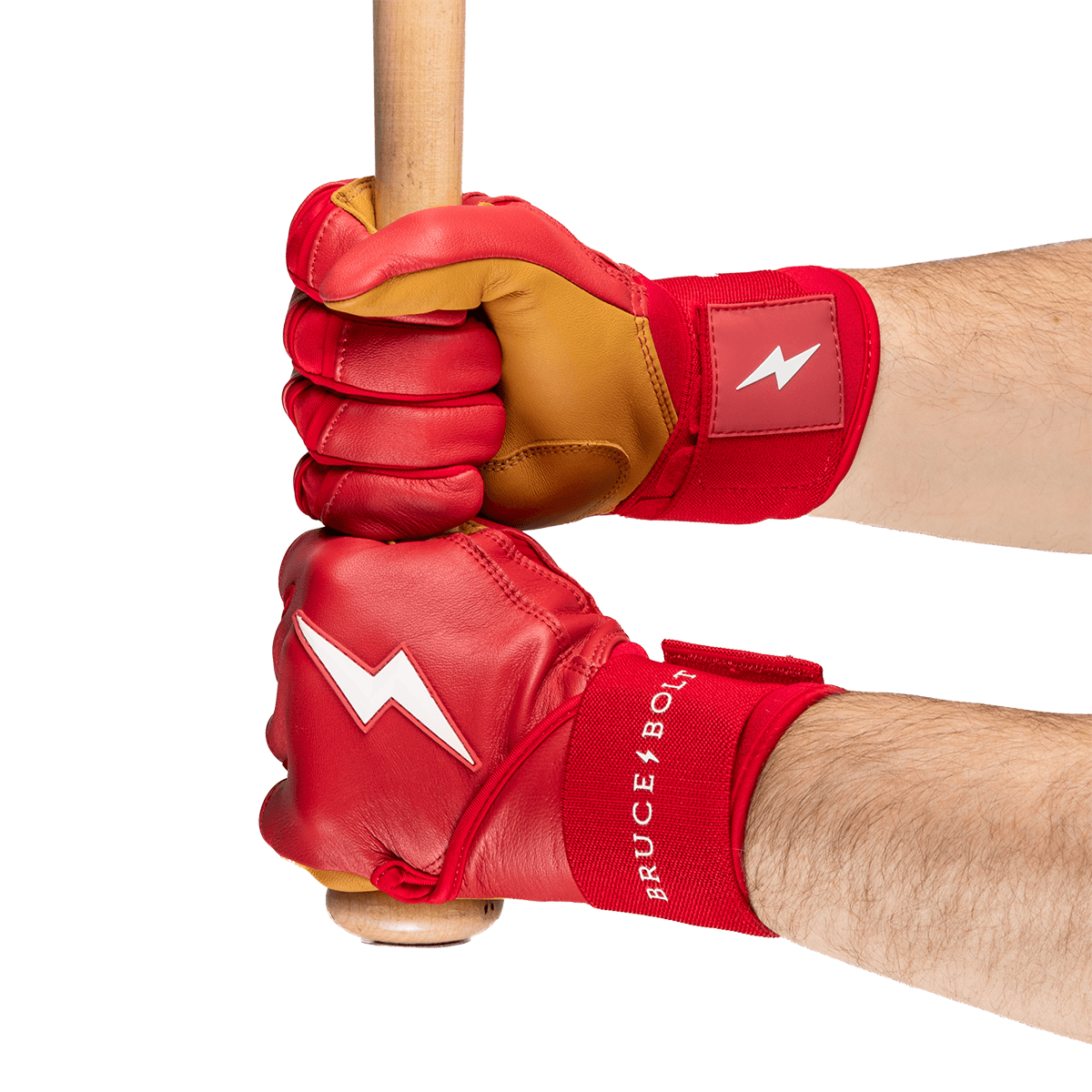 Close-up showing hands in red batting gloves with white lightning bolt logos and "BRUCE BOLT" text gripping a wooden baseball bat.