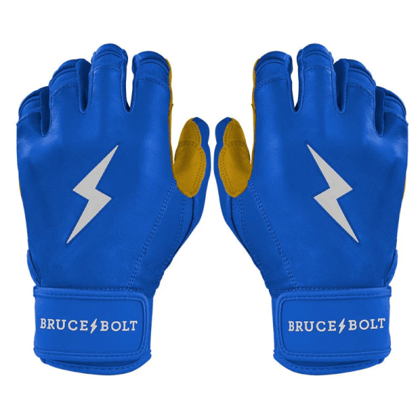 Front view of blue baseball batting gloves with gold accents, white lightning bolt logo, and "BRUCE BOLT" text on the wrist straps.