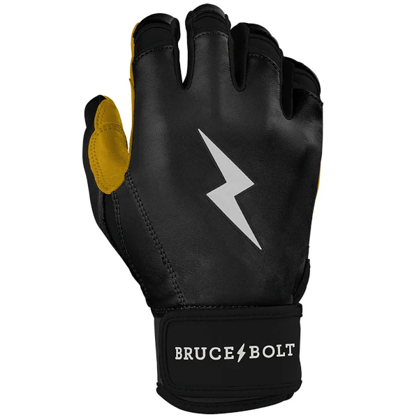 Front view of a black batting glove with yellow accents, a silver lightning bolt logo, and "BRUCE BOLT" text on the wrist strap.