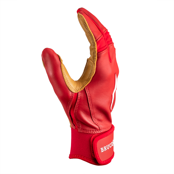 Side view of a red batting glove with tan palm, a white logo on the back, and "BRUCE" text on the wrist strap.