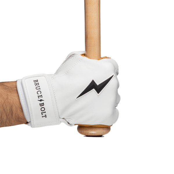 Close-up of a white batting glove with a black lightning bolt logo, displaying the words "BRUCE BOLT" on the wrist strap.