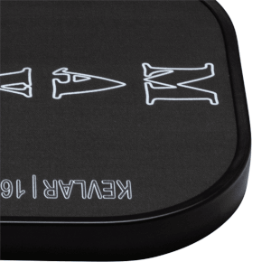 Corner view of the Dymon Mayhem paddle showing white lettering "MAYHEM" and "KEVLAR | 16".
