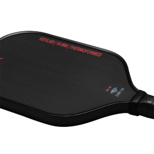 Corner view of a black Dymon Mayhem paddle, showing "KEVLAR | 16 MM | THERMOFORMED" and the Dymon logo.