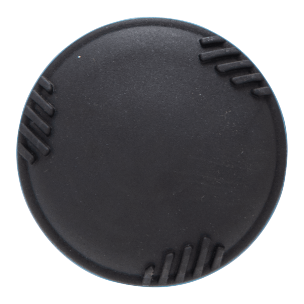 Top-down view of a black circular cap with ridged edges.