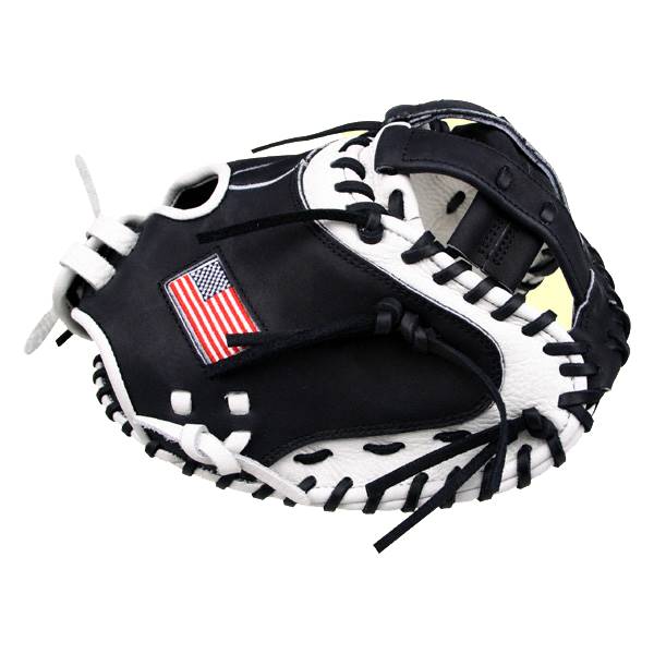 Top-down view of a black and white catchers mitt with an American flag patch and white lacing.